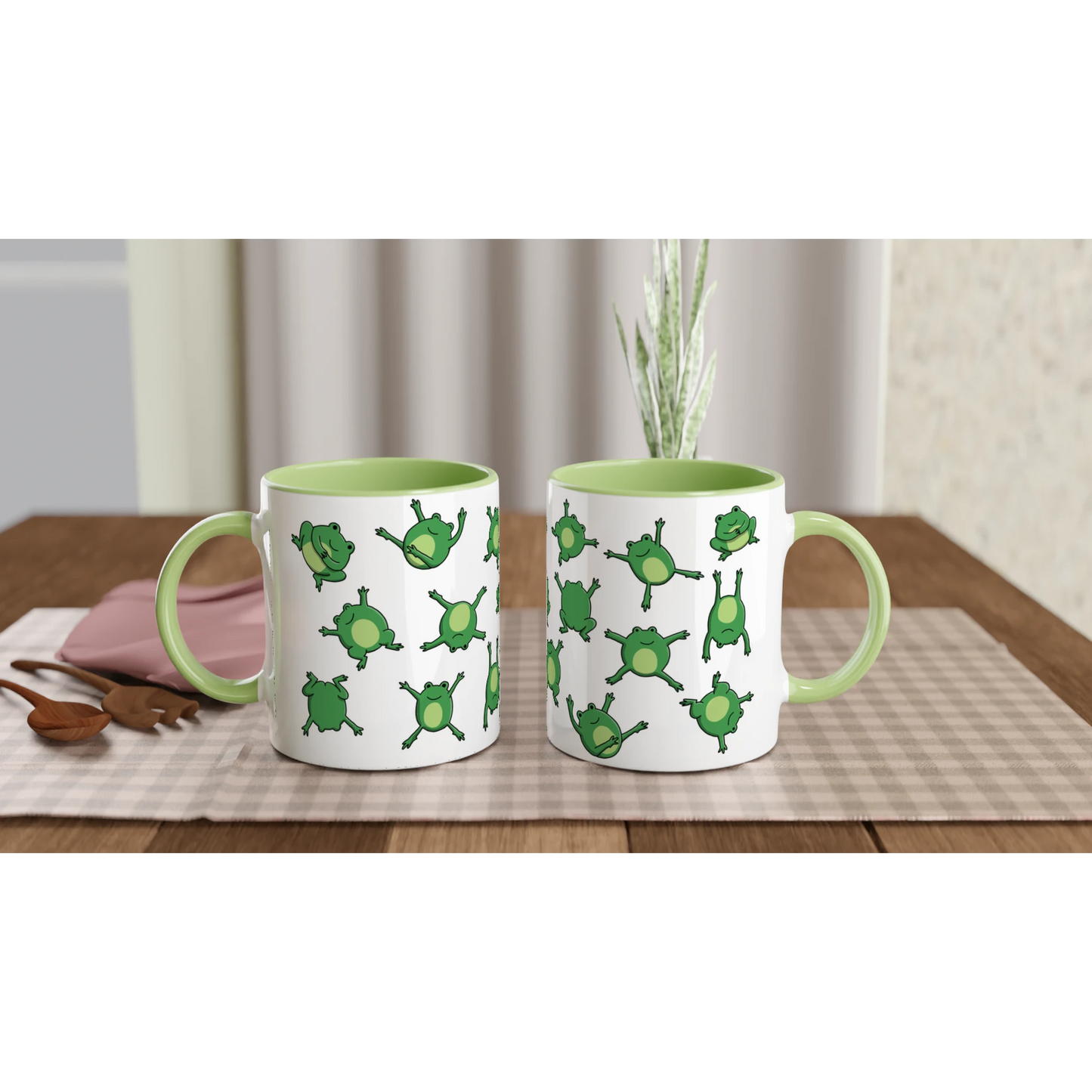 Astral Apple dish washer safe, microwave safe ceramic coffee mug in White and Green, with graphic print of lots of cute, smiling, cartoon style frogs , front and back, for the person who loves frogs