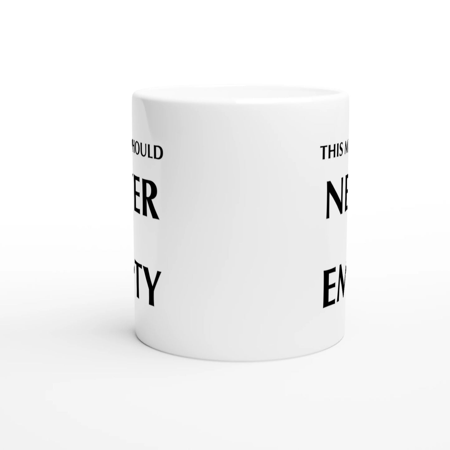 Astral Apple white, microwave and dishwasher safe, 11oz, ceramic mug with graphic print of the text, “This Mug Should Never Be Empty”, middle view, funny mug design