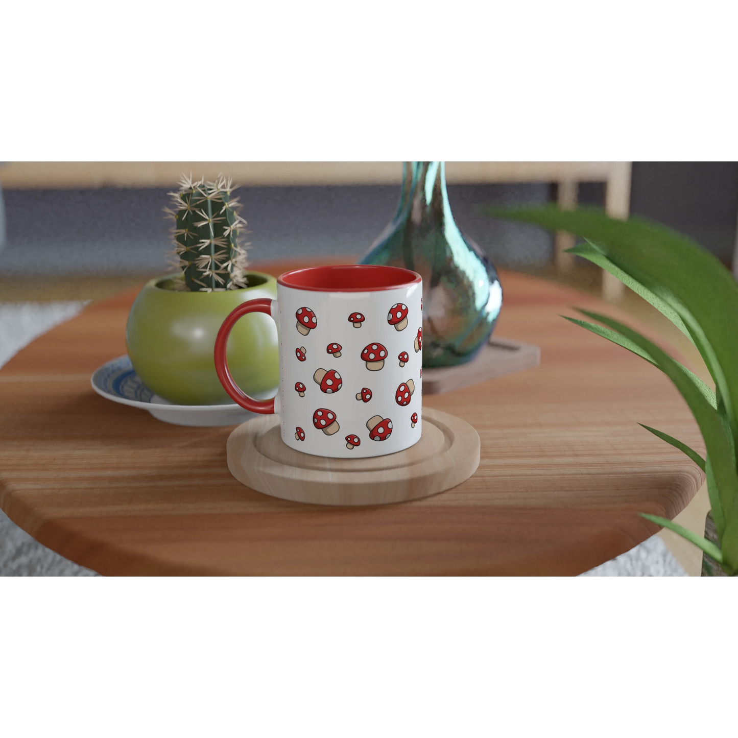Astral Apple dish washer safe, microwave safe ceramic coffee mug in White and Red, with graphic print of lots of little red fly agaric or Amanita Muscaria mushrooms with white spots, on a table, for the mycologist who loves mushroom coffee, tea and hot chocolate