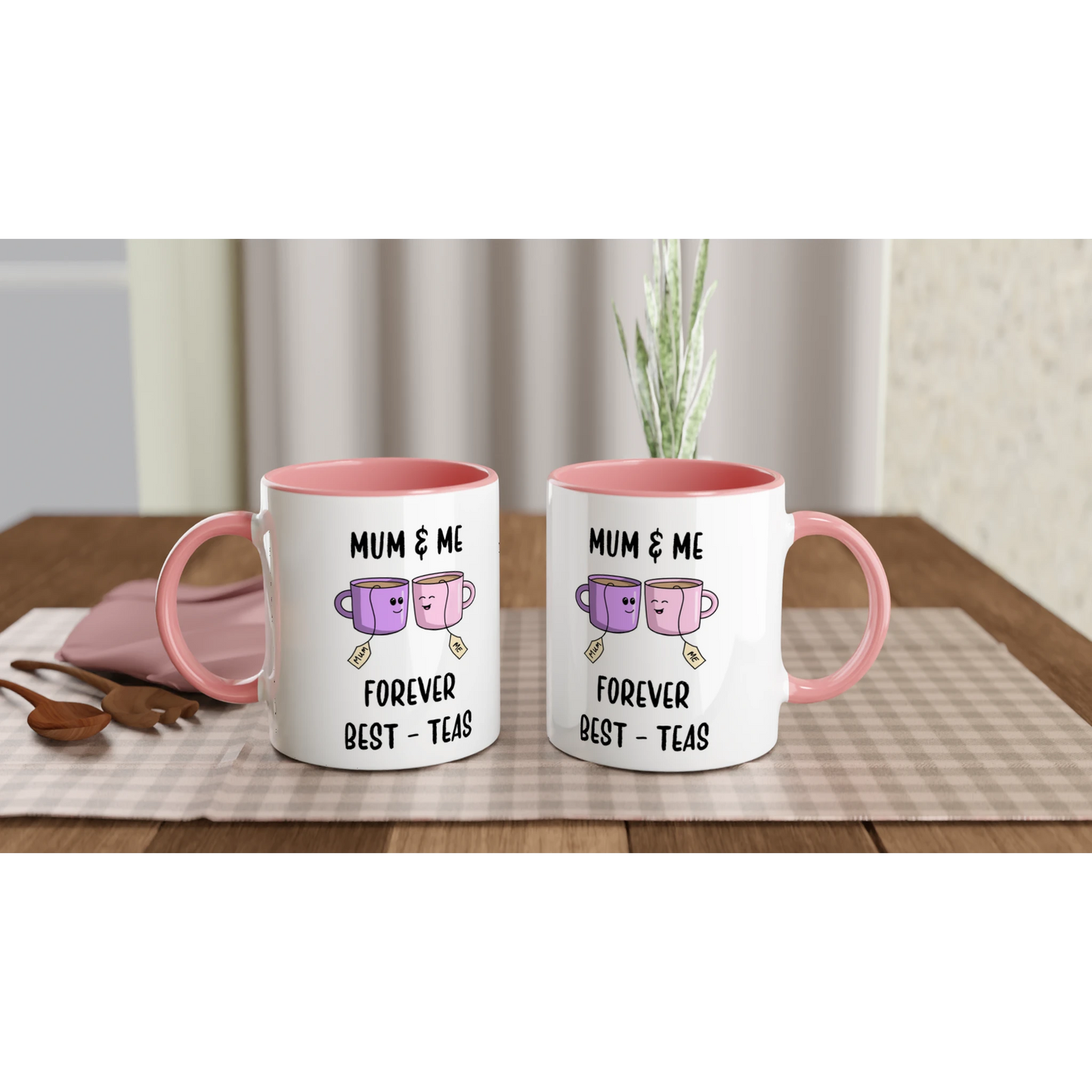 2 white ceramic mugs with the pun "Mum and me, forever best-teas" and an image of 2 cups