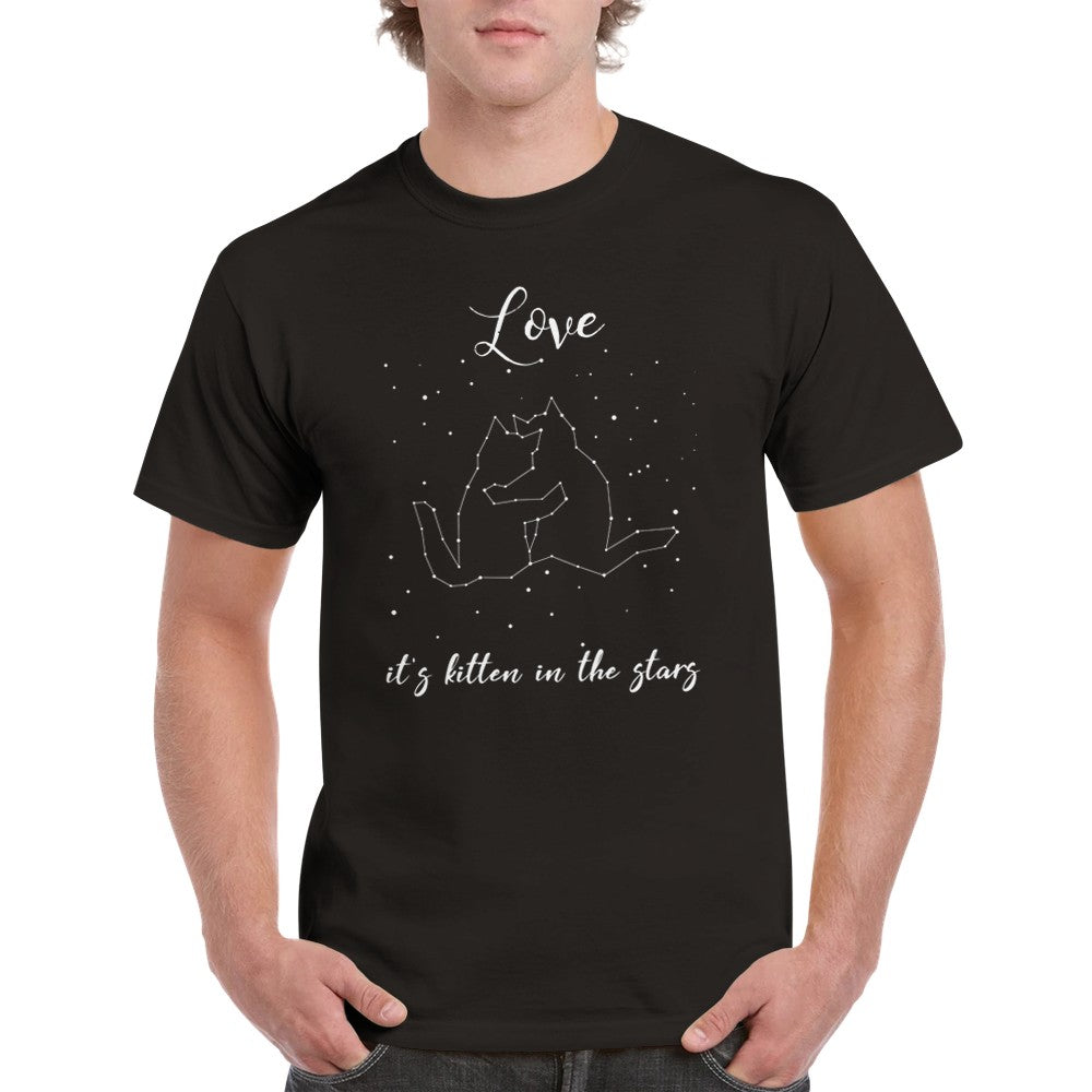 A man wearing a black t shirt with the words, "Love, it's kitten in the stars" in white and a picture of stars in the night sky, showing a cuddling cat pair constellation