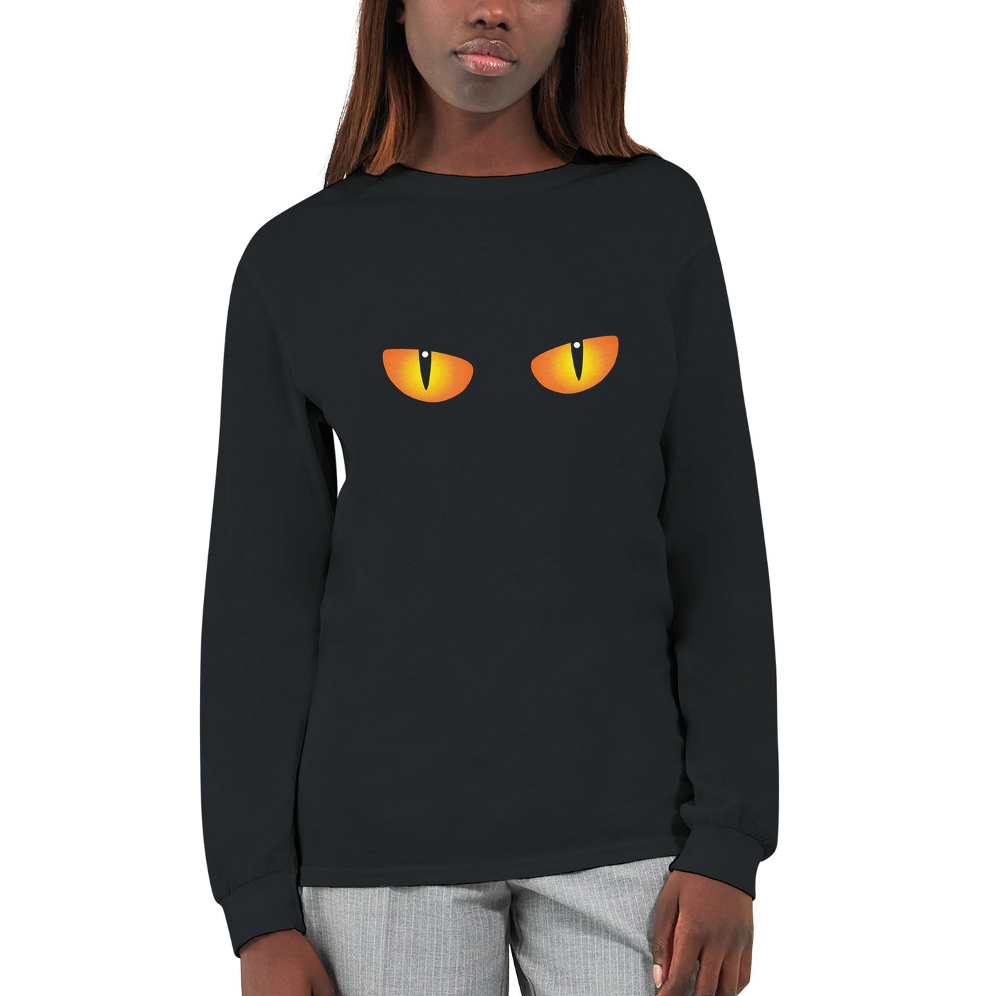 A black, long sleeved Halloween t shirt with a spooky cat's eyes with a closeup on a woman.