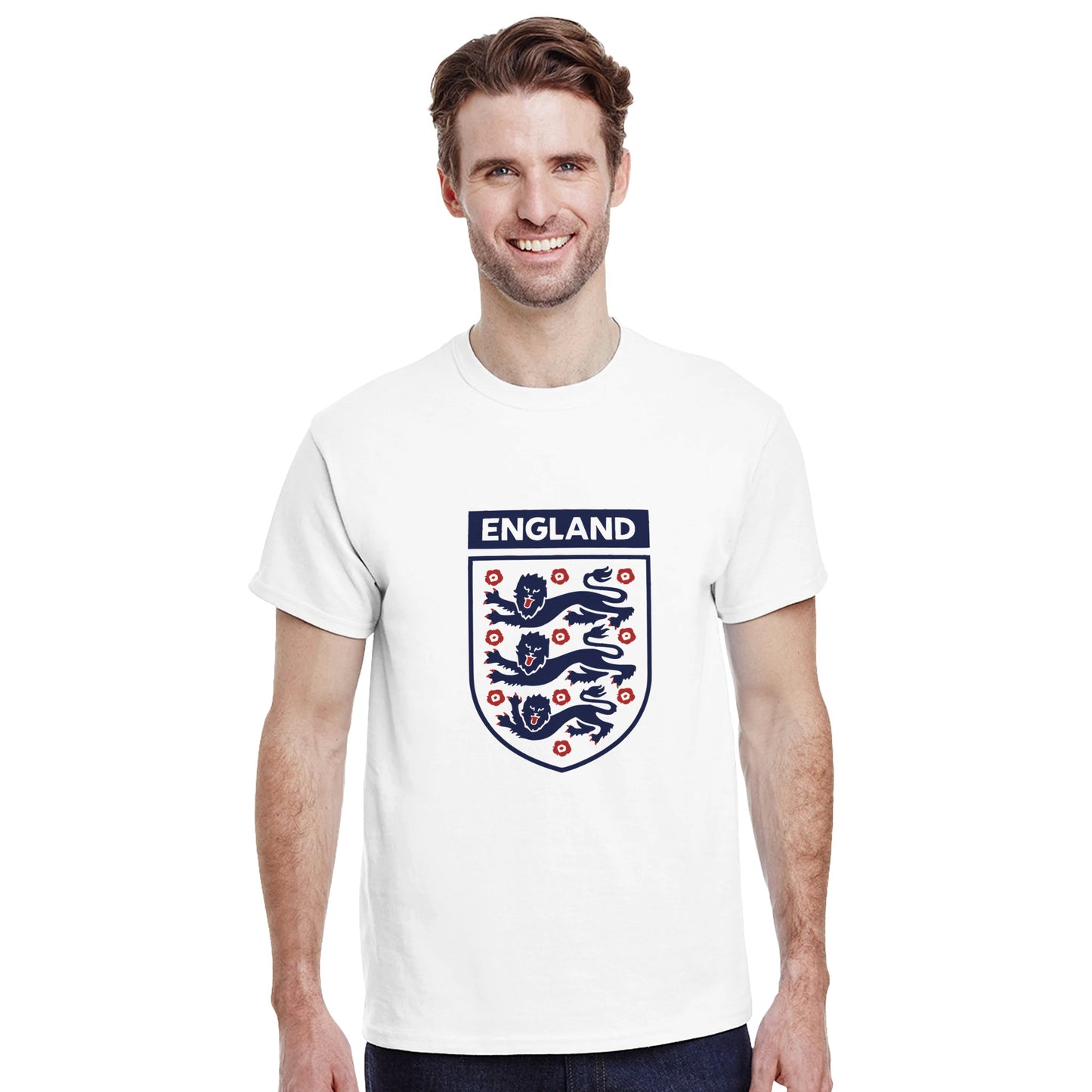 a white football t-shirt with England written on the top and a shield with 3 lions being worn by a man