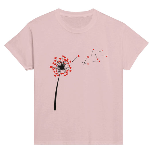 Child's pink t-shirt with heart dandelion seeds being blown into the wind.