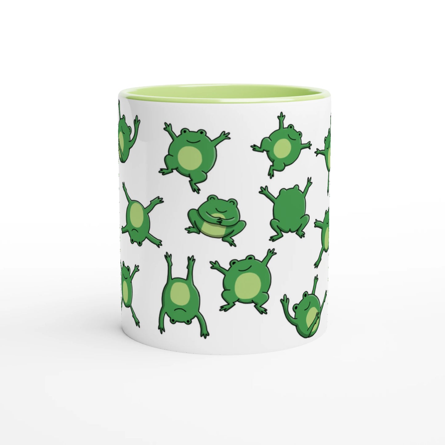 Astral Apple dish washer safe, microwave safe ceramic coffee mug in White and Green, with graphic print of lots of cute, smiling, cartoon style frogs , middle view, for the person who loves frogs