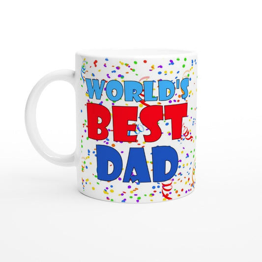 A white ceramic mug with the words, "world's best dad" in blue and red and multicoloured rainbow confetti in the background