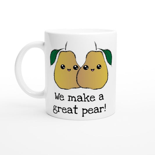 A white ceramic mug the black text saying, "we make a freat pear!" and a picture of two pears next to each other, smiling