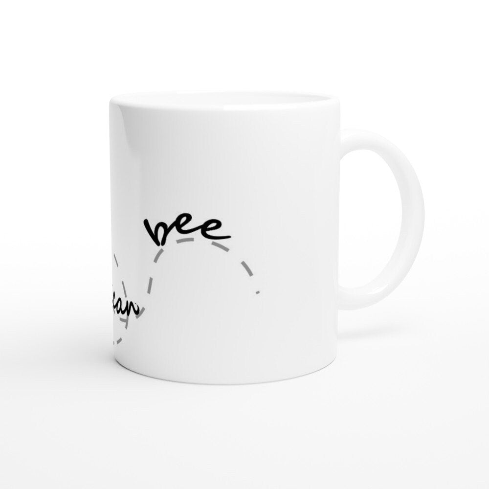 The back view of a white ceramic mug with black text saying, "Sweet as can bee" and the image of a drawing of a bee and it's path across the cup.